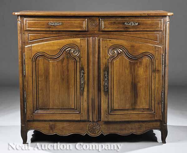 Appraisal: A French Provincial Fruitwood Buffet th c rectilinear top above