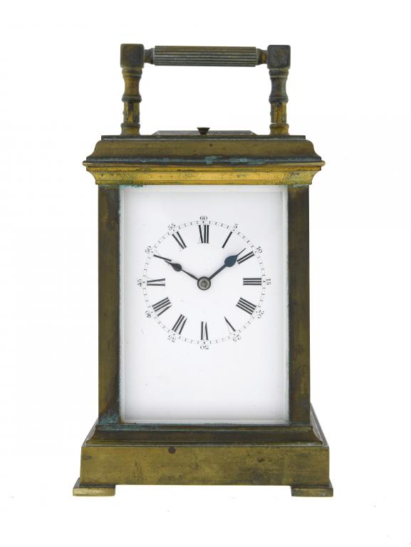 Appraisal: A FRENCH GILT BRASS CARRIAGE CLOCK with white enamel mask