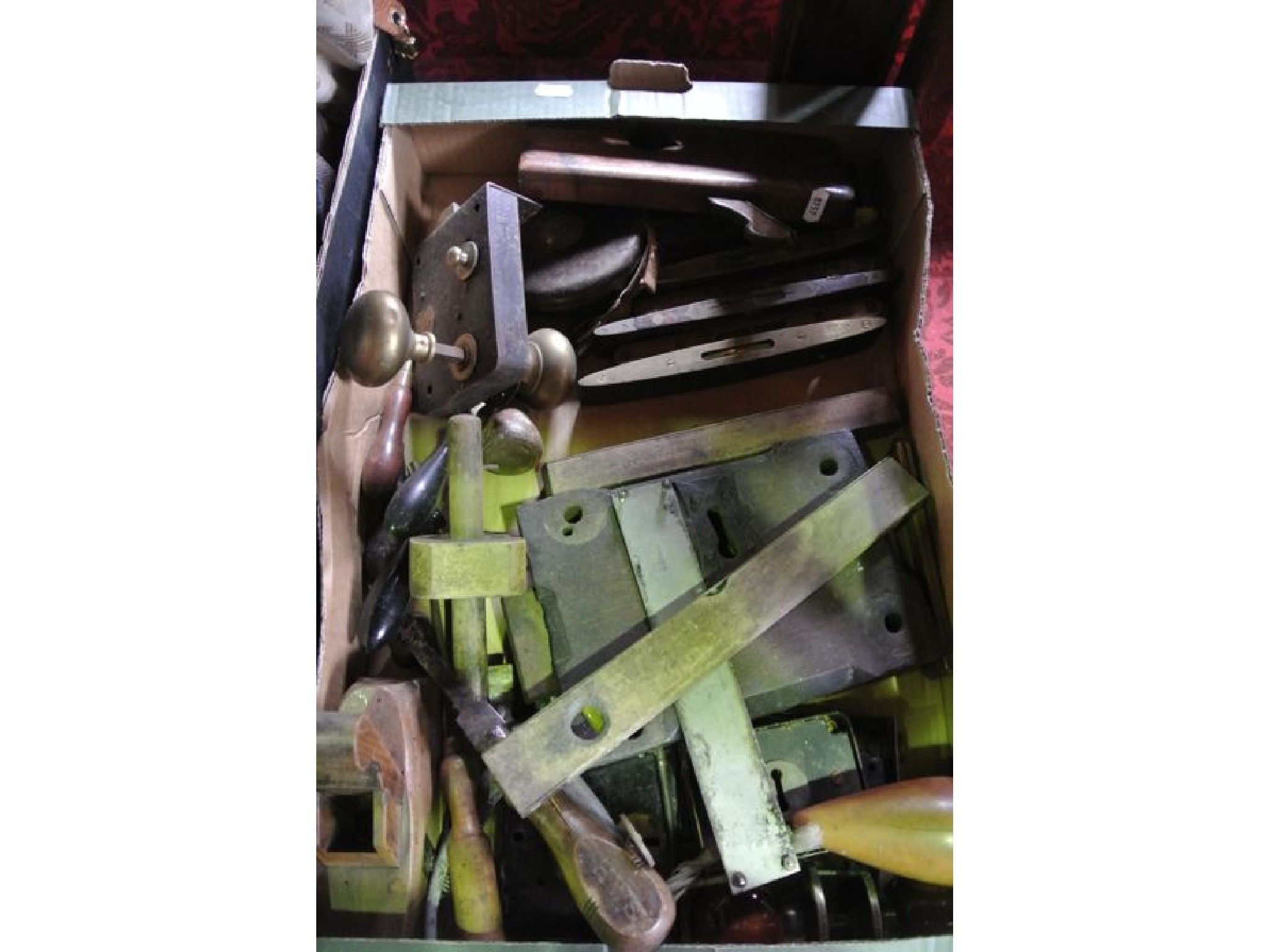 Appraisal: A box containing an assortment of vintage door lock plates