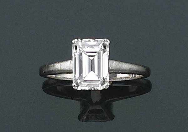 Appraisal: A diamond and platinum solitaire ring featuring an emerald-cut diamond