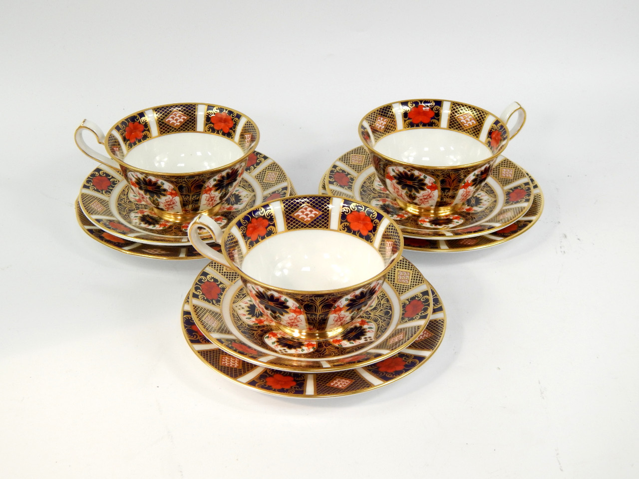 Appraisal: A set of three Royal Crown Derby porcelain trios decorated