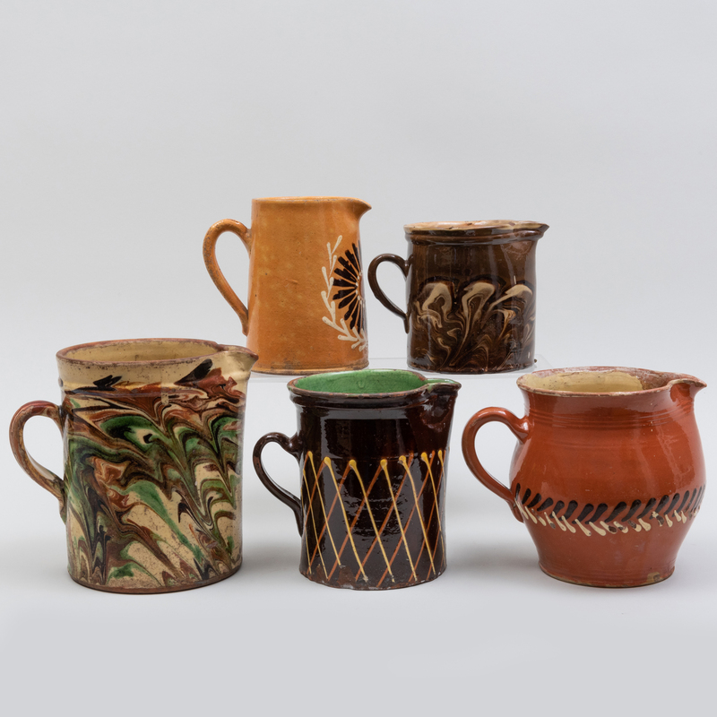 Appraisal: Group of Five Slip Decorated Pitchers Unmarked The largest in