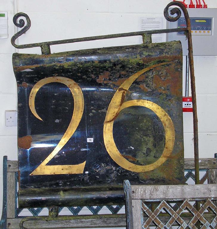 Appraisal: An art nouveau wrought iron shop sign painted with the