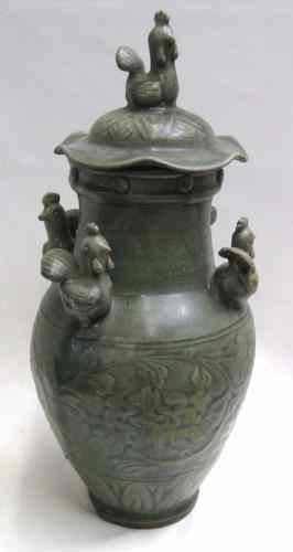 Appraisal: CHINESE POTTERY COVERED JAR The green field with raised leafage