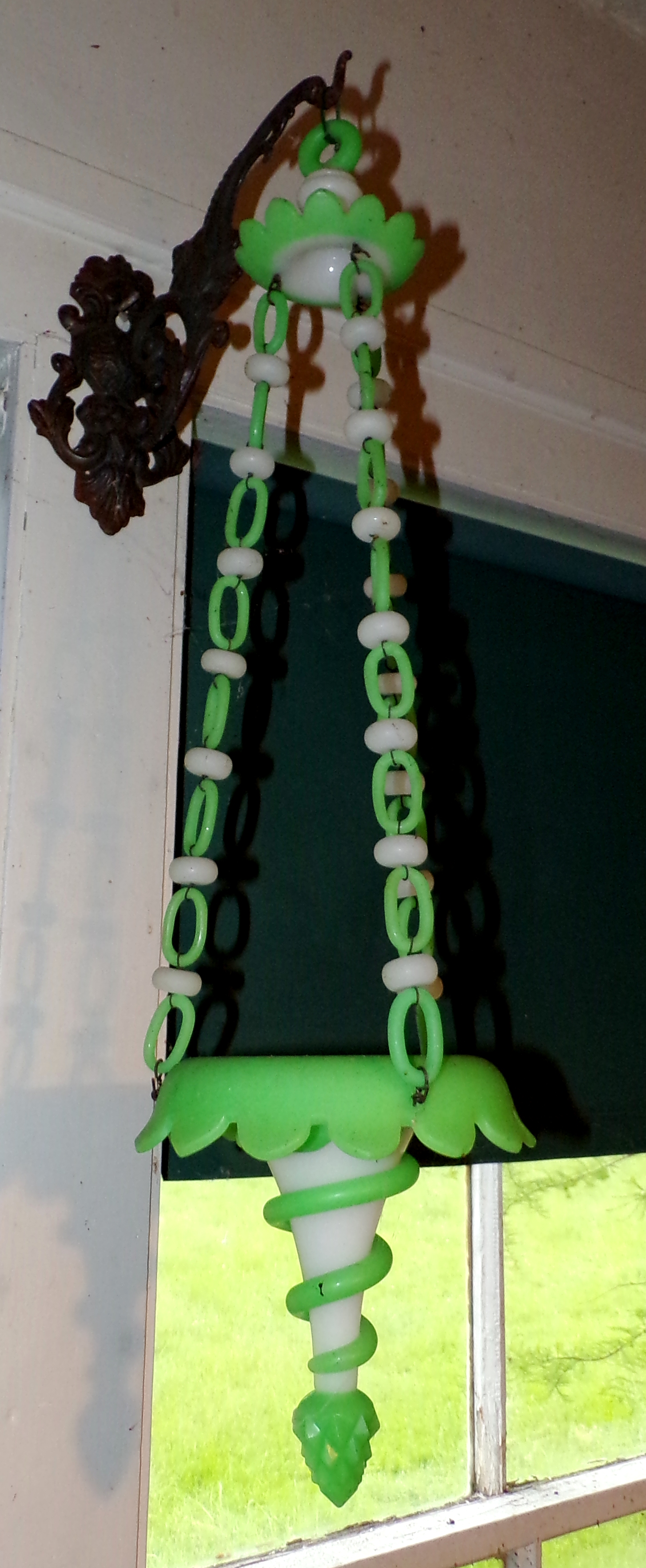 Appraisal: Jadeite and Milk glass hanging planter supported by three chain