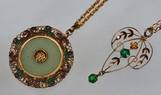 Appraisal: A CHINESE HARDSTONE ENAMEL AND GILT METAL CIRCULAR PENDANT and