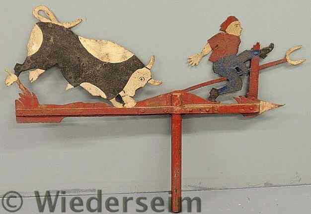 Appraisal: Wrought iron weathervane of a boy being chased by a