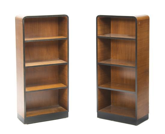 Appraisal: A Pair of Art Deco Walnut Bookcases having arched top