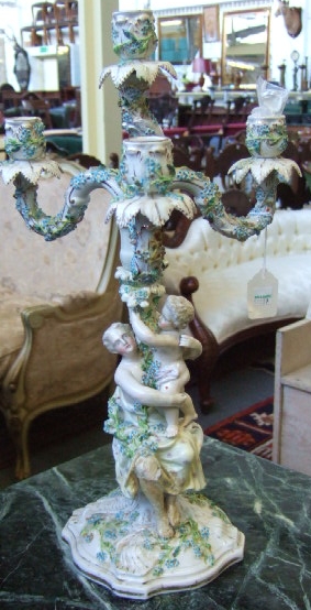 Appraisal: A pair of Sitzendorf four branch porcelain figural candelabra th