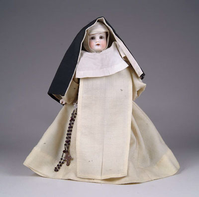 Appraisal: SMALL BISQUE NUN DOLL Complete with habit and rosary beads