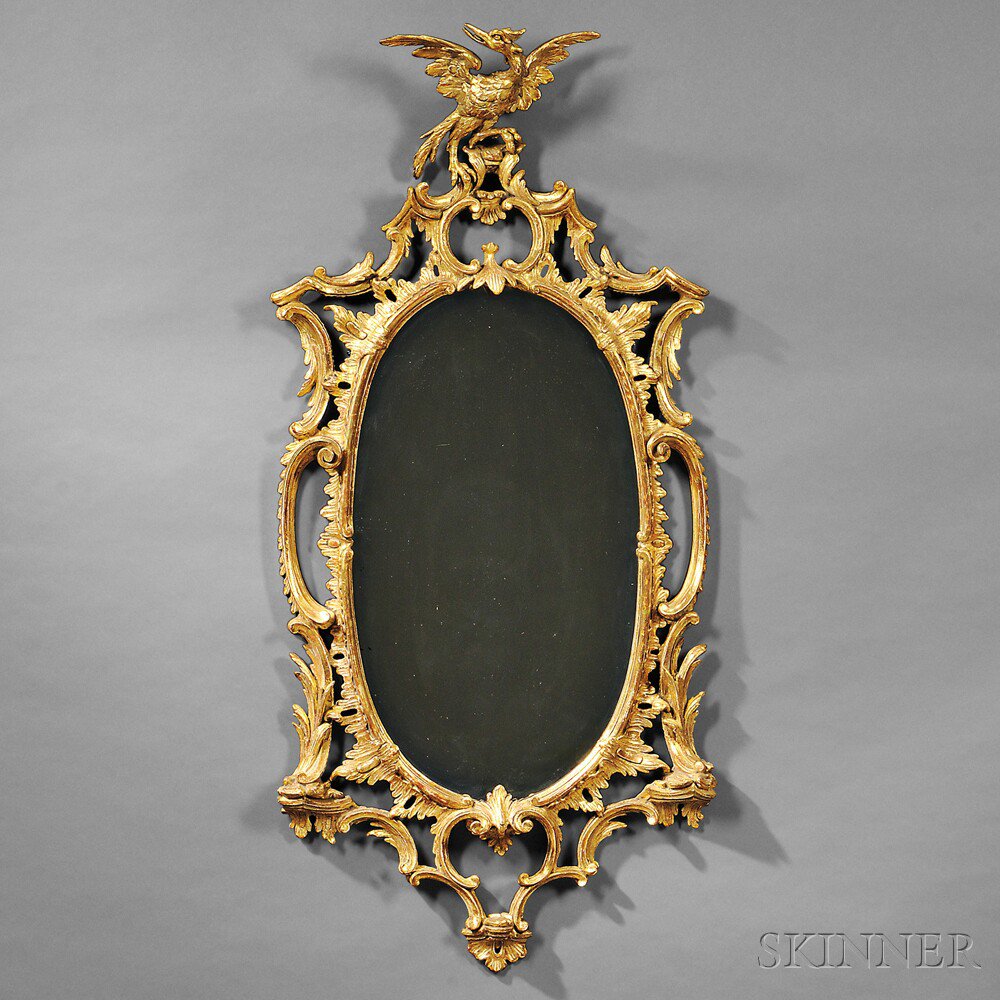 Appraisal: Georgian-style Giltwood Mirror oval mirror plate framed within pierced C-scrolls