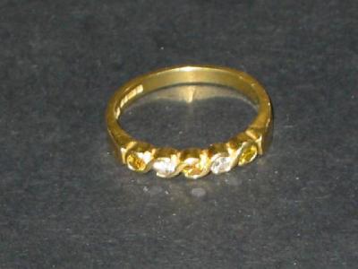 Appraisal: A DIAMOND HALF HOOP ETERNITY RING set with five alternating