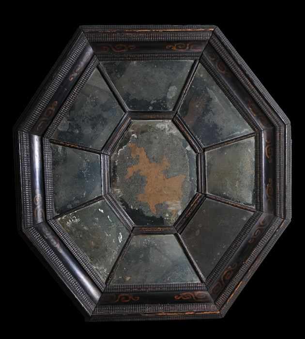 Appraisal: FLEMISH BAROQUE EBONIZED AND PAINT DECORATED OCTAGONAL MIRROR With central