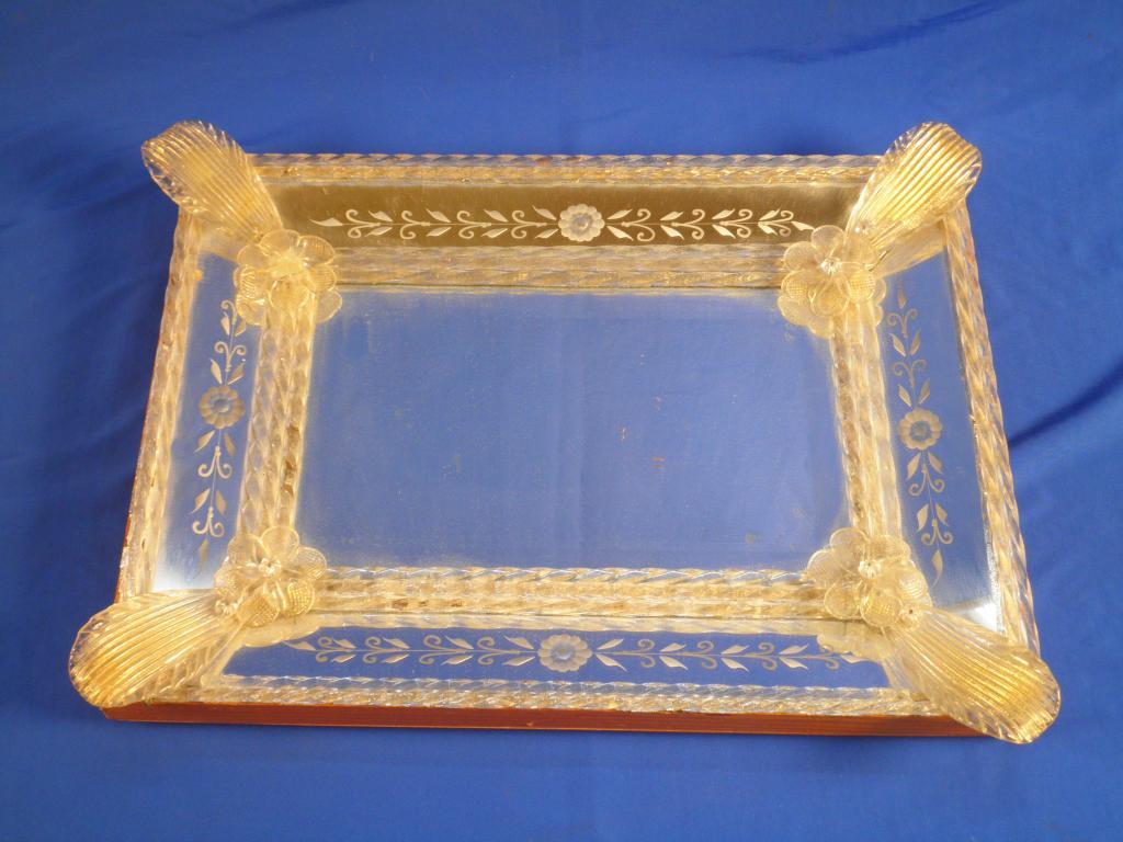 Appraisal: A Venetian glass rectangular wall mirror with spiral twist borders