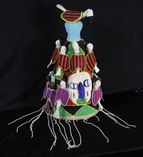 Appraisal: Yoruba Nigeria decorative beaded head dress having face masks and