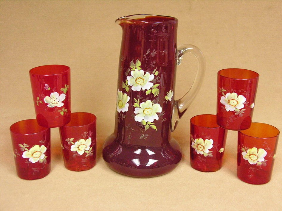 Appraisal: VICTORIAN RED ENAMELED WATER SET The handle is clear and