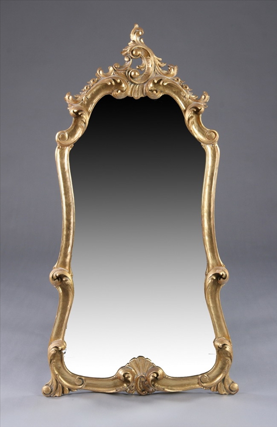 Appraisal: CONTINENTAL ROCOCO STYLE GILTWOOD HANGING WALL MIRROR th century Scrolling