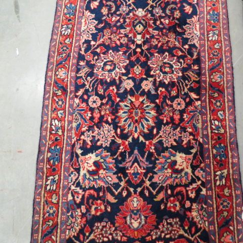 Appraisal: Sarouk Persian Handmade Runner fancy floral on blue field red