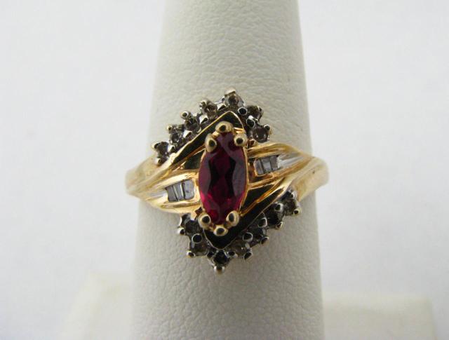 Appraisal: K yellow gold ruby ring with marquis ruby center stone