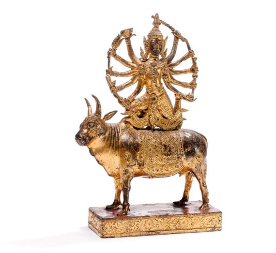 Appraisal: A TEN-ARMED GOD on a bull Thailand Rattanakosin height cm