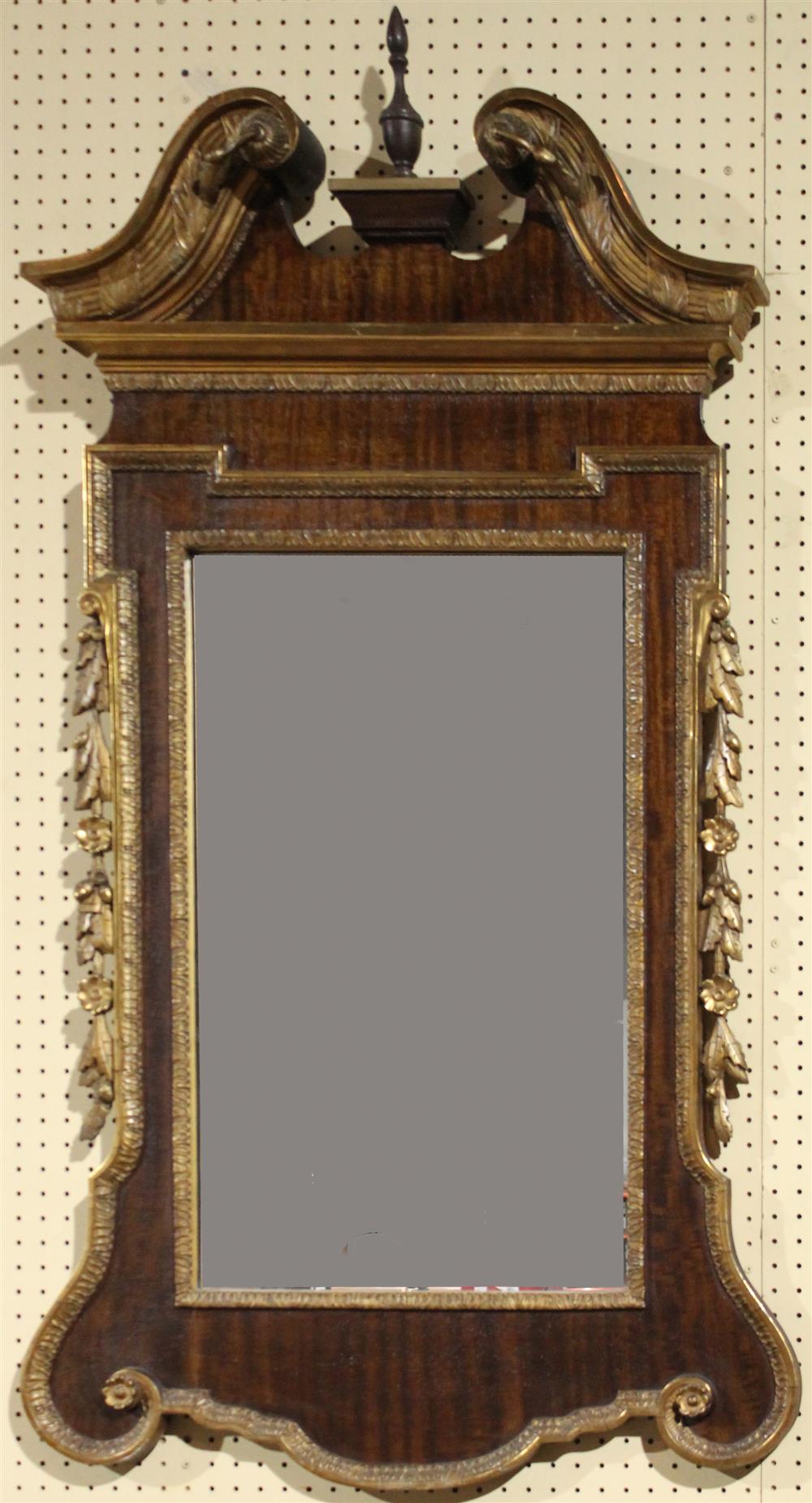 Appraisal: CHIPPENDALE STYLE CENTENNIAL PARCEL GILT AND MAHOGANY MIRROR having a