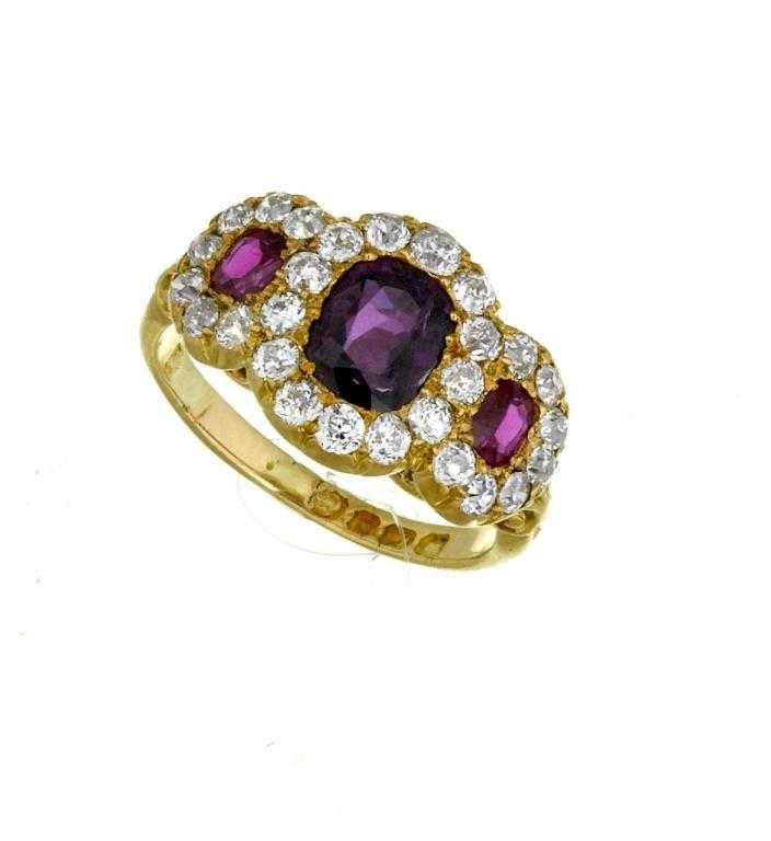 Appraisal: A RUBY AND DIAMOND TRIPLE CLUSTER RING ct gold hoop