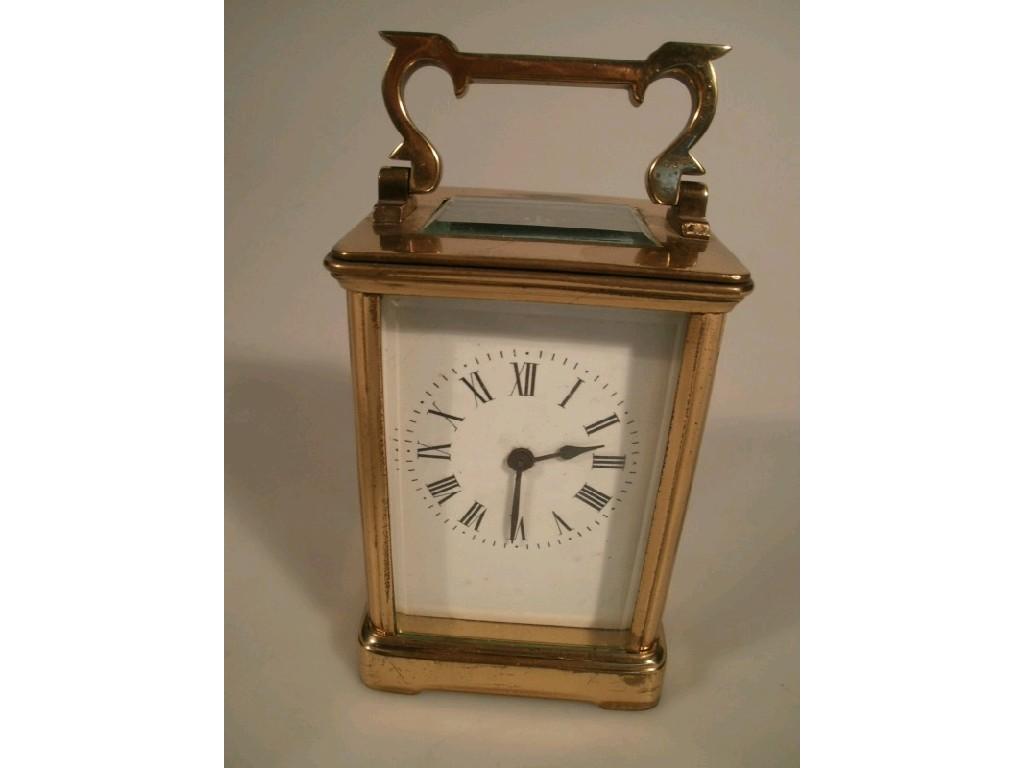 Appraisal: A brass cased carriage clock with plain white enamel dial