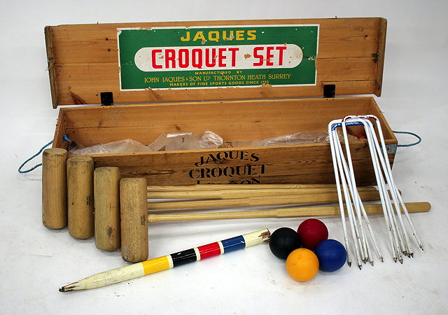 Appraisal: A JAQUES CROQUET SET with mallets balls hoops and a