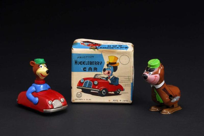 Appraisal: Lot of Tin Yogi Bear Toys Description Both are working