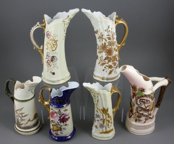 Appraisal: Collection of six circa Carlsbad Austria handled pitchers with handpainted