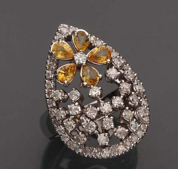 Appraisal: A yellow sapphire diamond and k white gold ring estimated