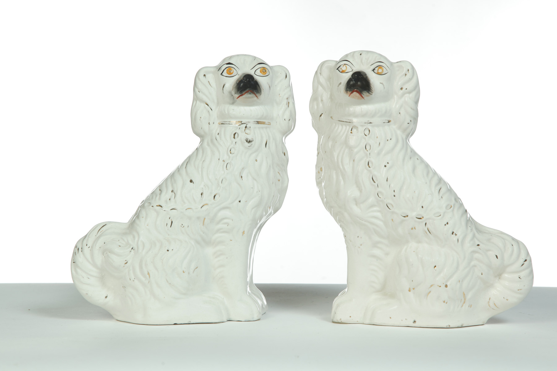 Appraisal: PAIR OF STAFFORDSHIRE SPANIELS England rd quarter- th century High