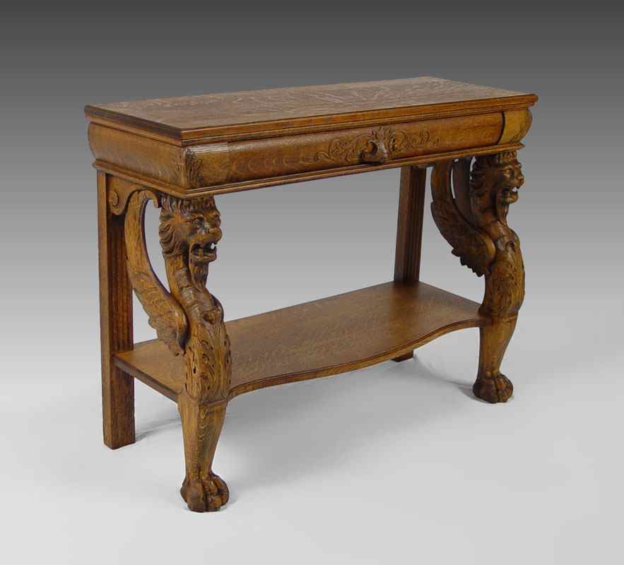 Appraisal: CARVED OAK GRIFFIN CONSOLE TABLE Single drawer table with three