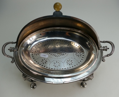 Appraisal: A Victorian silver plated large roll top bacon serving dish