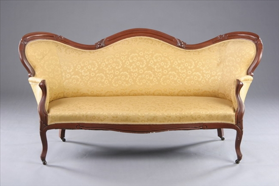 Appraisal: AMERICAN ROCOCO REVIVAL WALNUT FRAMED SOFA Mid-to-late th century Serpentine