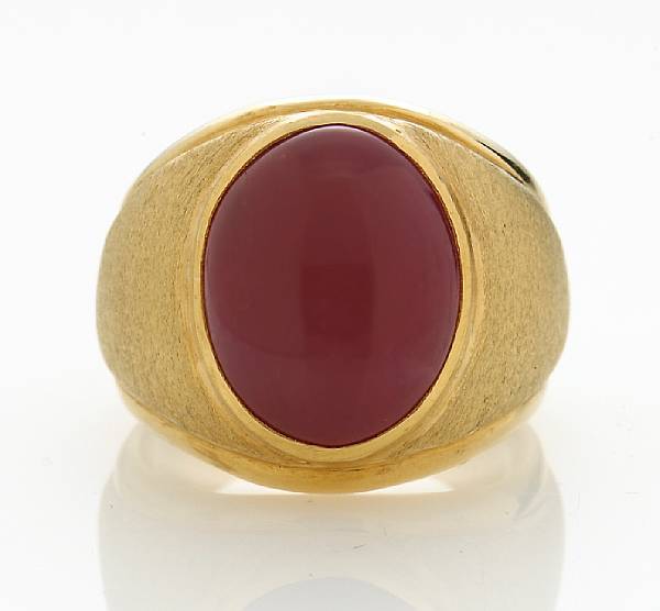 Appraisal: A ruby cabochon ring centering an oval-shaped ruby cabochon measuring