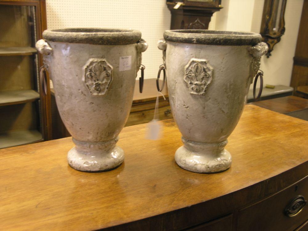 Appraisal: A pair of ceramic garden urns glazed in white and