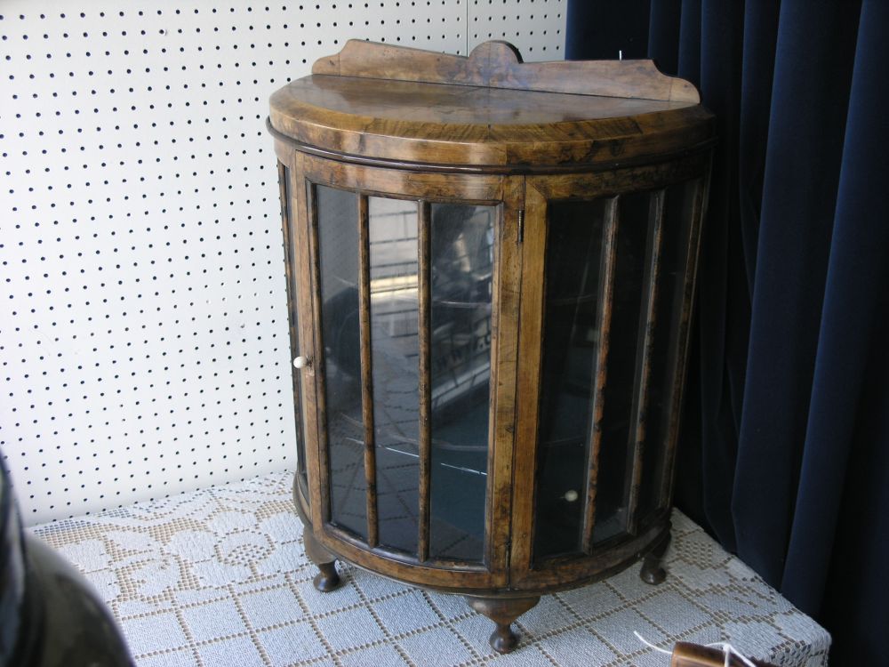 Appraisal: A 's miniature burr walnut veneered display cabinet half-round shape