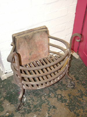 Appraisal: A wrought iron fire basket the square back with three