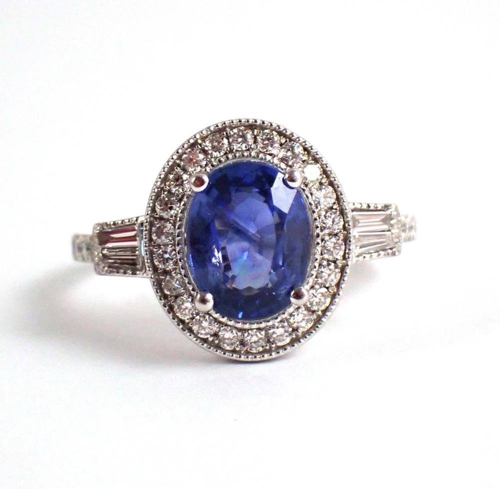 Appraisal: SAPPHIRE DIAMOND AND PLATINUM RING with round and baguette diamonds