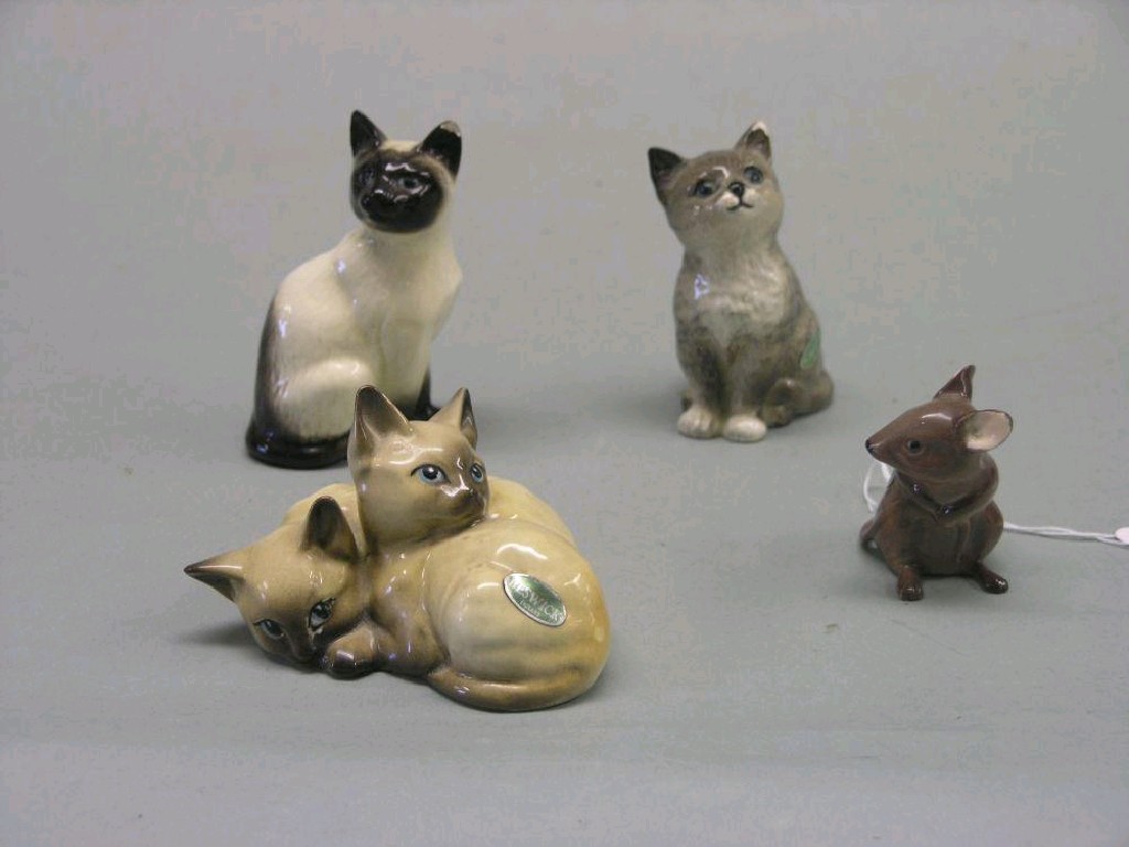 Appraisal: Three Beswick cats and mouse Siamese Kittens curled together Siamese