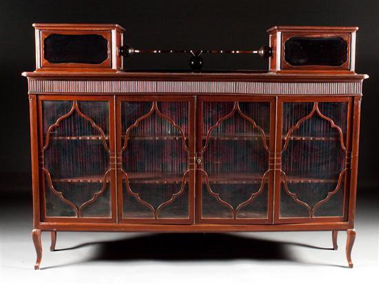 Appraisal: Continental Art Deco carved mahogany glass panel four-door bookcase circa