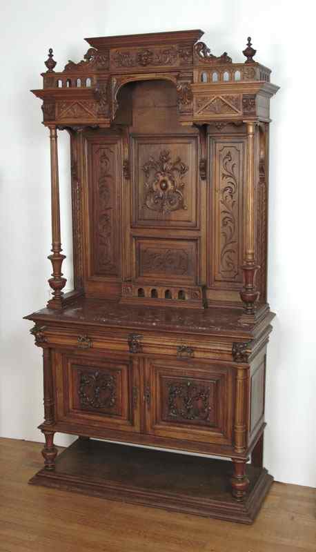 Appraisal: HEAVILY CARVED WALNUT BACKBAR WITH MARBLE TOP Heavily carved crest