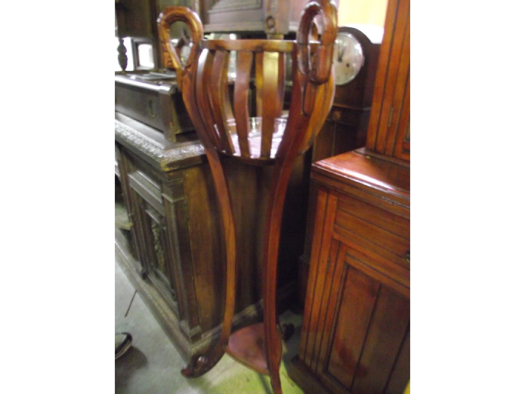 Appraisal: A reproduction hardwood jardiniere stand the circular open slatted bowl