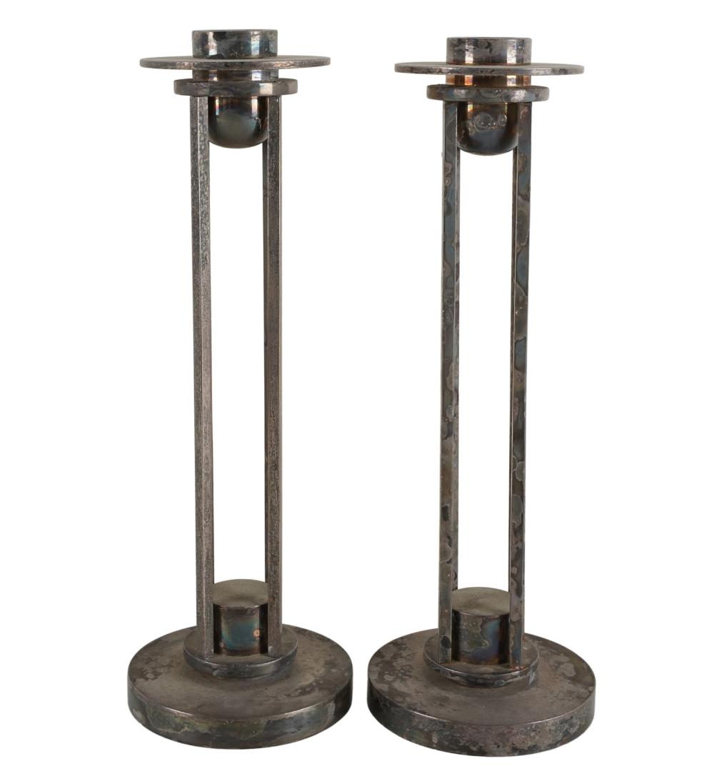 Appraisal: PAIR OF SWID POWELL SILVER PLATE CANDLESTICKSsigned to underside Condition