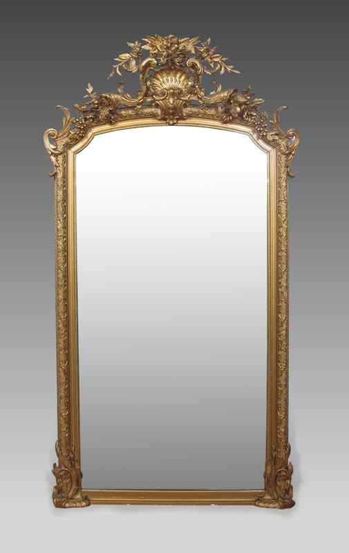 Appraisal: A CARVED AND GILT OVER MANTLE OR PIER MIRROR Elaborate