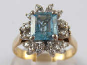 Appraisal: A yellow metal tests carat gold aquamarine and diamond ring