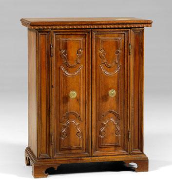 Appraisal: Italian baroque style carved cabinet walnut with two heavy doors