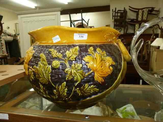 Appraisal: A LARGE YELLOW GLAZED POTTERY PLANTER with foliate design and