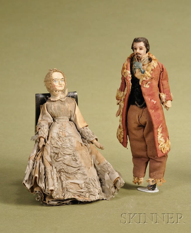 Appraisal: Two Small Dolls mid- th century a wax gentleman with